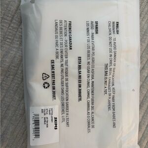 SKIMS white cotton jersey t shirt. NEVER WORN still in packaging with tags